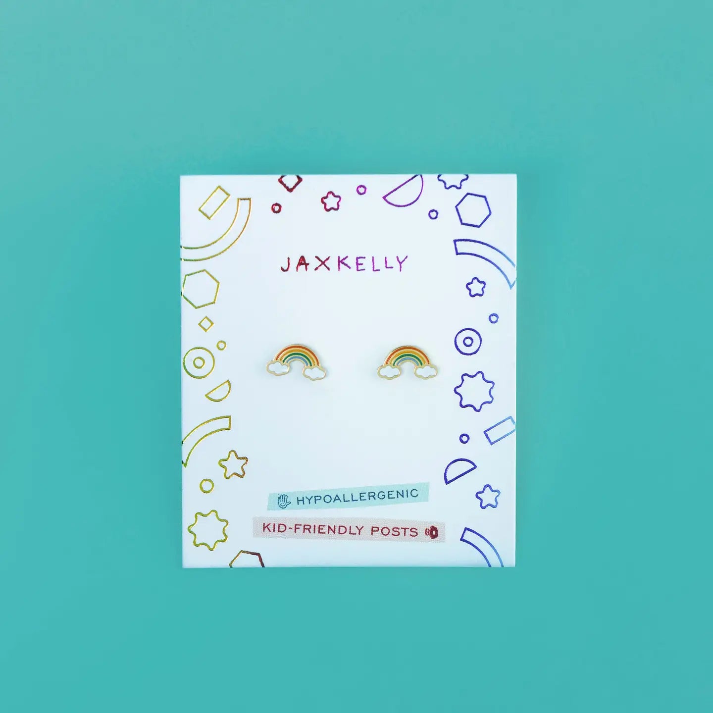 Rainbow Enamel Flat Back Kids Earrings, hypoallergenic and kid-friendly, are displayed on a white card with colorful geometric doodles labeled JaxKelly—perfect for sensitive ears—set against a teal background.