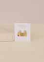 The Small Channel Gold Hoop earrings feature 18K gold plating and sterling silver posts, displayed on a “JaxKelly Wear Good Vibes” card against a pale, neutral background.