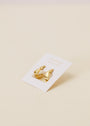 The Small Ripple Gold Hoop earrings feature 18K gold plating and sterling silver posts, displayed on a white card with gold text against a light beige background.