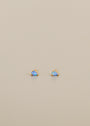 The Teardrop Stud - Fire Opal earrings feature lab-grown fire opal gemstones set in gold, shown on a plain light beige background.