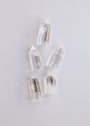 Five Mini Clear Quartz Crystal Points are arranged in a star shape on a plain white background, each point highlighting the natural beauty and clarity of this luminous gemstone.
