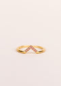 The Pink Lambda Ring features a v-shaped design in 18k gold plating, accented with pink cubic zirconia along the angled edge, shown on a simple light background.