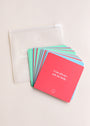 A set of Teens Shower Affirmations™ cards for teens is spread out beside a translucent pouch with a smiley face and white text. The top red card says, "I can always ask for help.