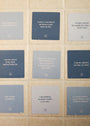 Sobriety Shower Affirmations™—nine waterproof blue and gray cards with self-control affirmations for sobriety—are arranged in a 3x3 grid on a tiled wall, each with water droplets, supporting your recovery journey.