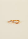 The Ring - Pave Wave - Champagne CZ features 18k gold plating and sparkling champagne cubic zirconia, shown against a plain, light beige background.