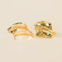 The Gold Bold Wave by JaxKelly: bold, abstract-shaped gold statement stud earrings with smooth curves and sterling silver posts, shown on a light background.