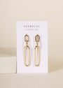 The Pave Link Drop - Earring features rectangular and oval chain links with 18k gold plating, displayed on a white JaxKelly card reading "WEAR GOOD VIBES" against a neutral background.
