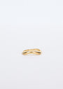 The Wave Ring, crafted in 18k gold with an elegant wave design, rests on a plain white background—an ideal choice for those who value timeless and lasting jewelry.