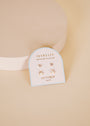 The Birthstone Stud Earring Set - October features opal and gold-plated earrings from the JaxKelly collection, shown on a white card labeled "October opal" with a soft beige background.