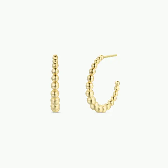 The JaxKelly Large Ball Hoop features tarnish-free gold hoops with graduated spherical beads in a curved design, displayed against a plain white background.