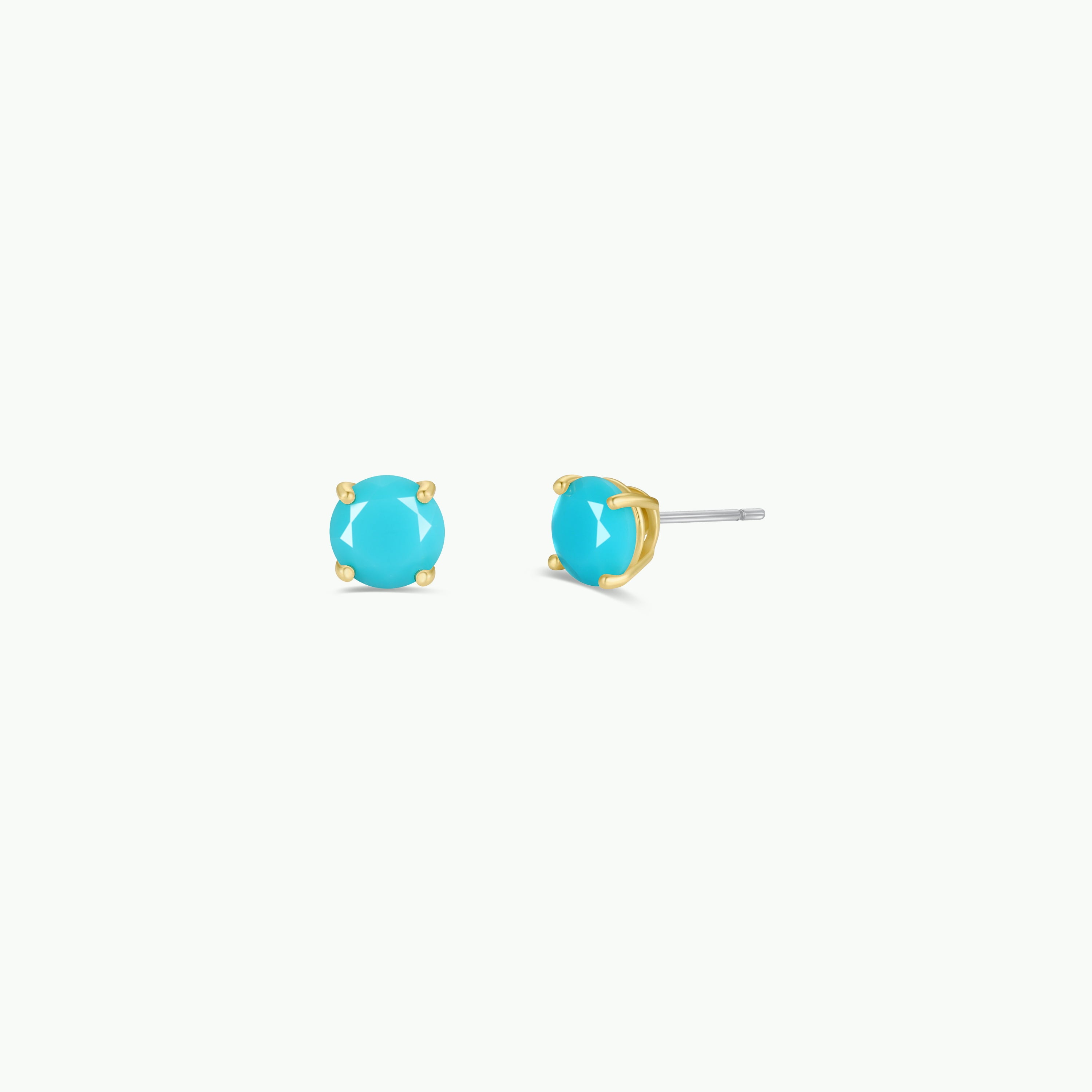 The Round - Turquoise Gemstone - Gold Earrings feature gold-plated minimalist studs with round turquoise stones in four-prong settings, displayed from front and side angles on a plain white background.