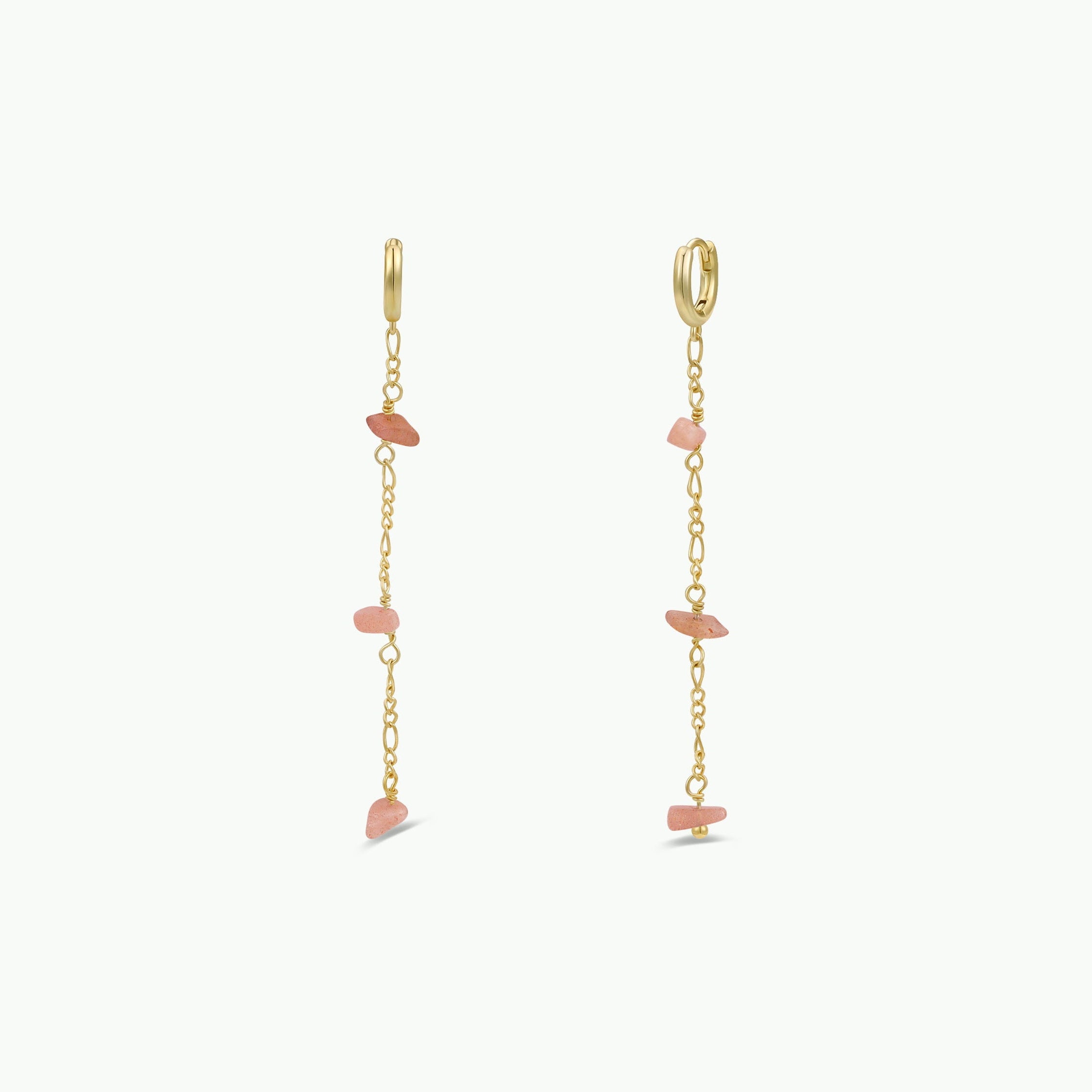 The Raw Gemstone Chain Drop Earring - Peach Moonstone features tarnish-free gold chains with small, irregular Peach Moonstone stones spaced along each chain, shown on a plain white background.