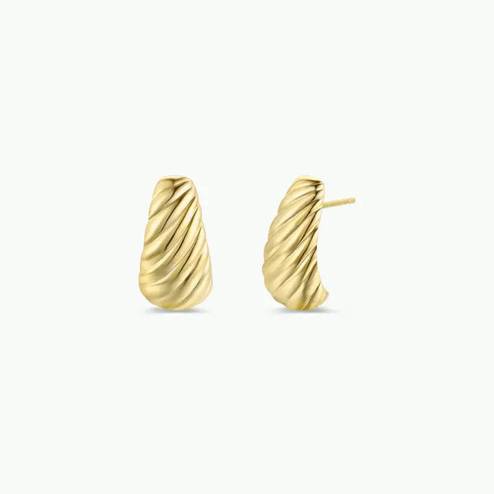 The JaxKelly Gold Bold Swirl Earrings are statement gold studs with a textured diagonal wave design. One earring is shown front-on and the other from the side, highlighting both the post and swirl details against a plain white background.