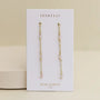 A pair of JaxKelly Gemstone Chain Drop - Rose Quartz earrings with 18k gold plating and rose quartz beads, shown on a white card labeled "JaxKelly" and "Rose Quartz love" against a neutral background.