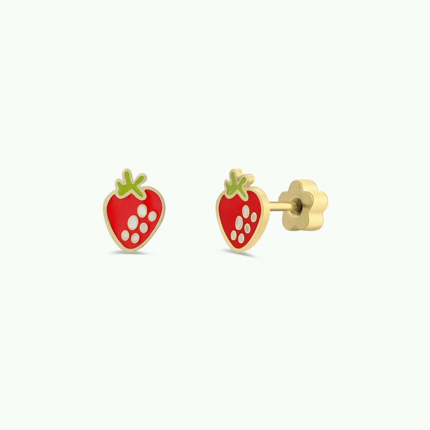 The Strawberry Enamel Flat Back Kids Earrings are gold, strawberry-shaped studs with red enamel, white dots, and green leaves. Hypoallergenic and ideal for sensitive ears, they are shown on a plain white background.
