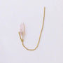 The JaxKelly Gemstone Threader - Rose Quartz earring features a delicate gold threader with a thin bar at one end and a rose quartz crystal point in a gold triangular setting, perfect for minimalist jewelry lovers. Displayed on a white background.
