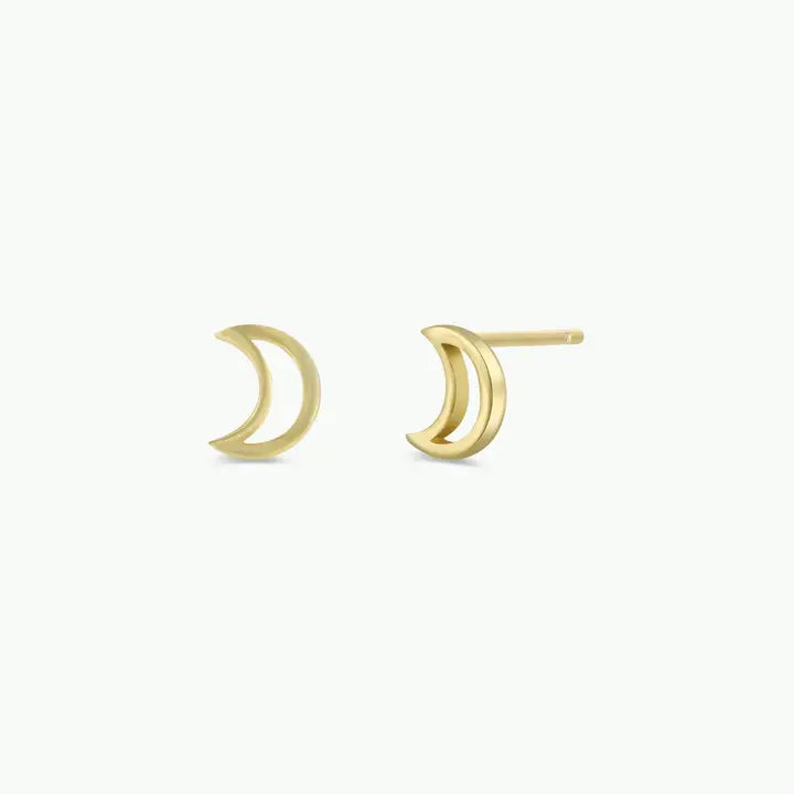 The Minimalist Moon earrings by JaxKelly are small, 18k gold-plated crescent moons with a hollow design, displayed against a plain white background.