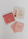 Self-Love Shower Affirmations™: A set of square, waterproof affirmation cards in pink shades, some stacked and some spread out. The visible card says, “I am capable of doing hard things. I get better every single day.” Guide card included.