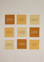 The Strength Shower Affirmations™ set features twelve square tiles in cream, tan, and brown, each with an inspiring message at the center, offering encouragement and empowerment during your daily routine.