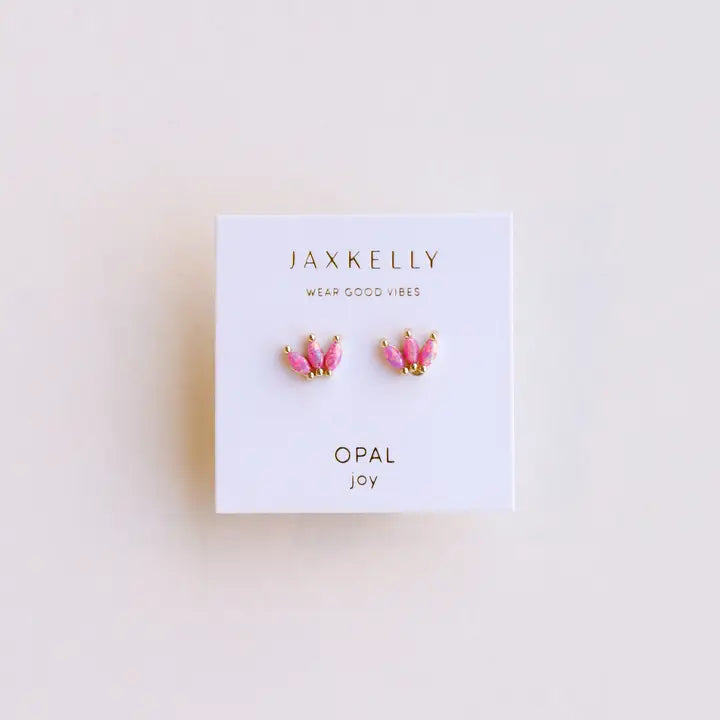 JaxKelly Pink Opal Crown stud earrings feature lab-grown pink opals in crown shapes with 18k gold plating, shown on a white JaxKelly Wear Good Vibes, Opal Joy card against a light background.