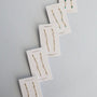Five pairs of JaxKelly Gemstone Chain Drop earrings in Rose Quartz, featuring 18k gold plating and small gemstones, are displayed on white branded cards with gemstone names, arranged diagonally on a light gray background.