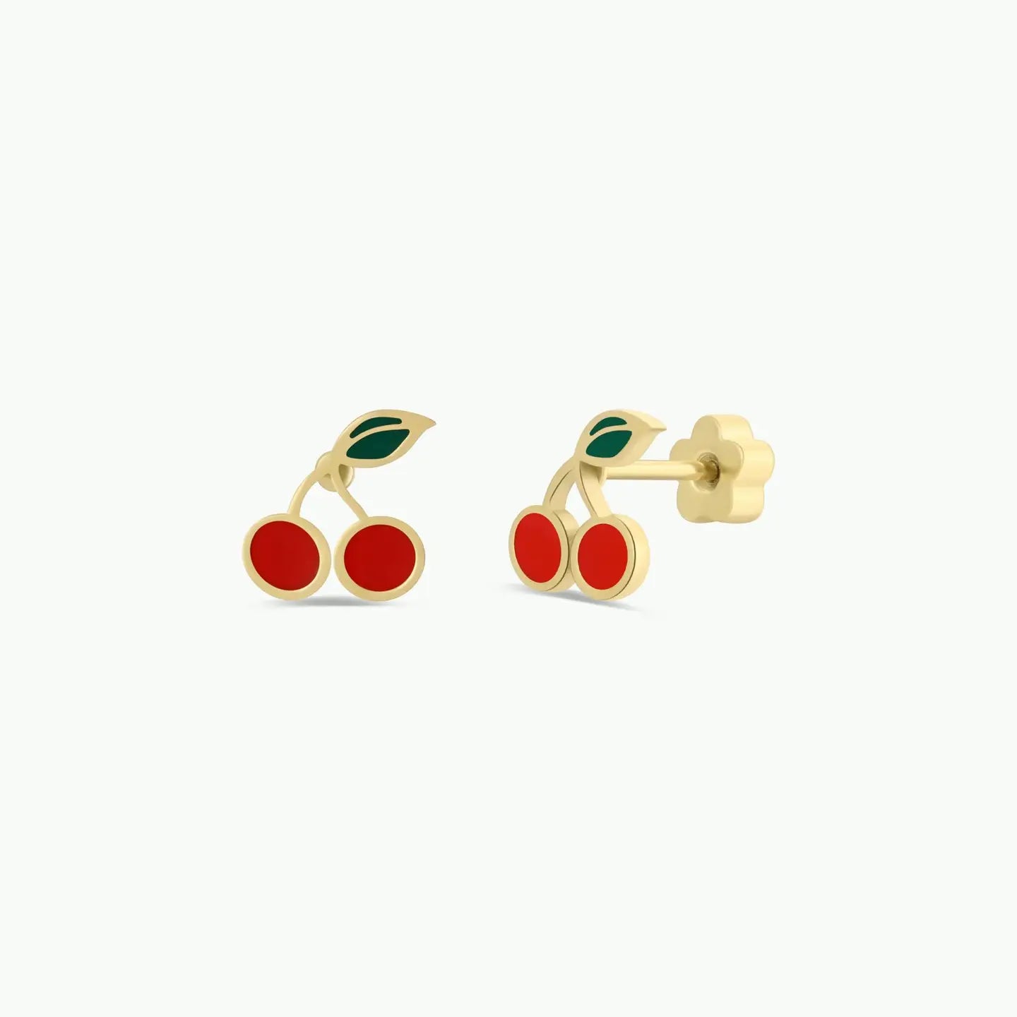 Cherry Enamel Flat Back Kids Earrings: Gold, hypoallergenic studs shaped like cherries with red fruit and a green leaf, ideal for sensitive ears. Perfect for kids and displayed on a plain white background.