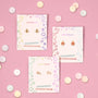 The Bumble Bee Enamel Flat Back Kids Earrings are displayed on a JaxKelly branded card on a pink background with pastel candies—perfect hypoallergenic earrings for sensitive children's ears.