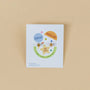 A square card on beige displays “Popsicle Enamel Flat Back Kids Earrings” with labels: “Secure Flat Screw-Back,” “Surgical Grade Stainless Steel,” “18K Gold Plated,” and below, “Nickel, Lead & Copper Free”—ideal for sensitive ears.