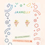 JaxKelly Ballerina Enamel Flat Back Kids Earrings featuring gold-tone ballerinas in pink dresses, displayed on a branded card as hypoallergenic kids earrings.