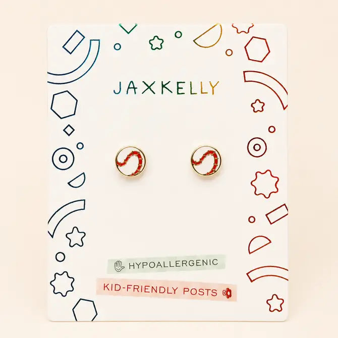 A pair of JaxKelly Softball Enamel Flat Back Kids Earrings, featuring a red and white circular design, are displayed on a card labeled Hypoallergenic and Kid-Friendly Posts with colorful geometric decorations. Crafted from surgical-grade stainless steel, these earrings provide both safety and style for kids with sensitive ears.