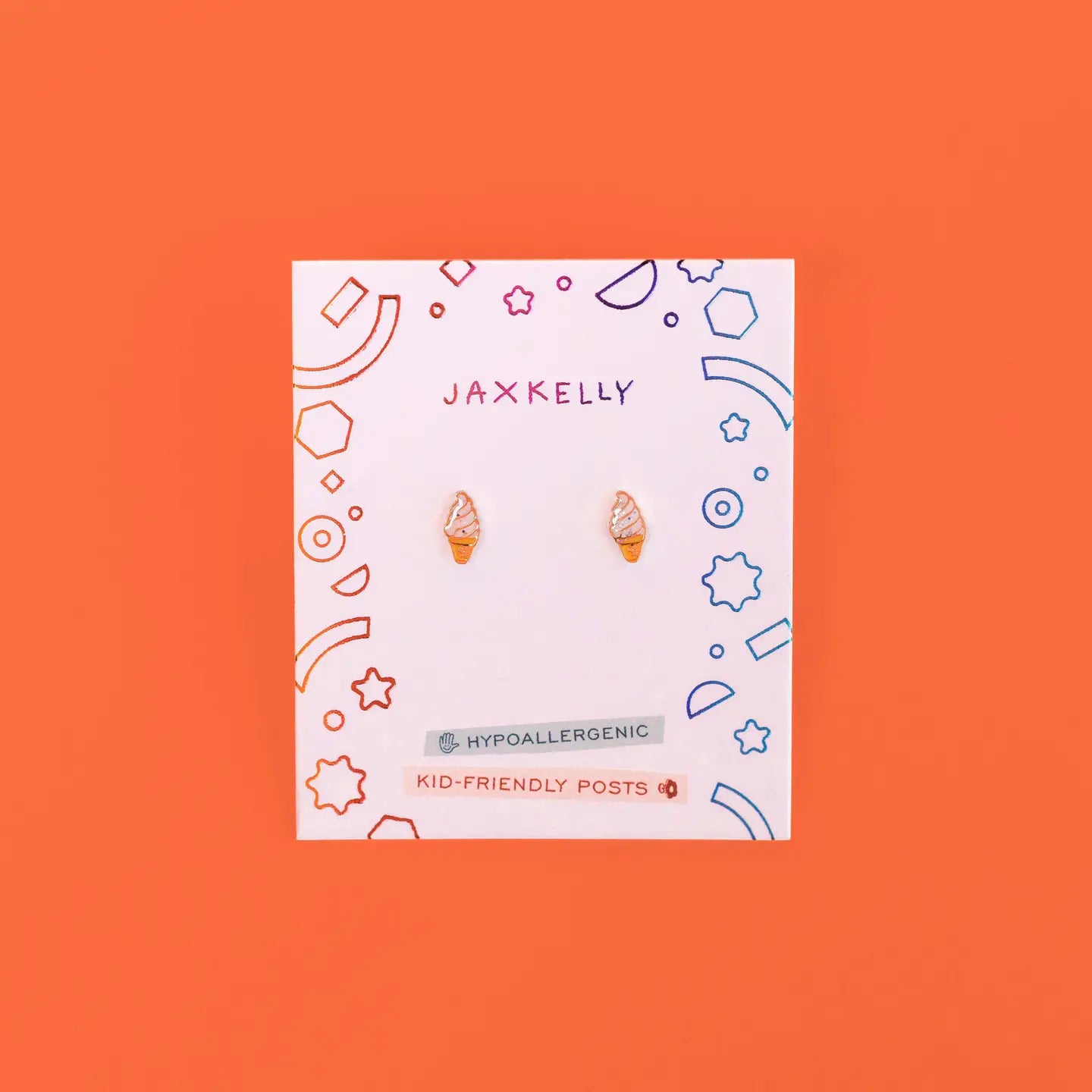 The Ice Cream Enamel Flat Back Kids Earrings are displayed on a colorful JaxKelly card labeled Hypoallergenic and Kid-Friendly Posts, set against an orange background. Perfect for playful style and sensitive ears.