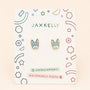 A pair of Frenchie Enamel Flat Back Kids Earrings is displayed on a decorative card labeled JaxKelly, with “Hypoallergenic” and “Kid-Friendly Posts” printed below the earrings. These hypoallergenic earrings are perfect for sensitive ears, providing both comfort and style for little ones.