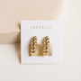 Twisted Hoop earrings by JaxKelly feature 18k gold plating with sterling silver posts, displayed on a white card with gold JaxKelly lettering against a soft beige background for an elegant, timeless look.