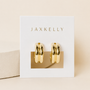 A pair of Bold Hoop earrings by JaxKelly, featuring shiny gold hoops with sterling silver posts, displayed on a white card with JaxKelly in gold lettering against a soft beige background.