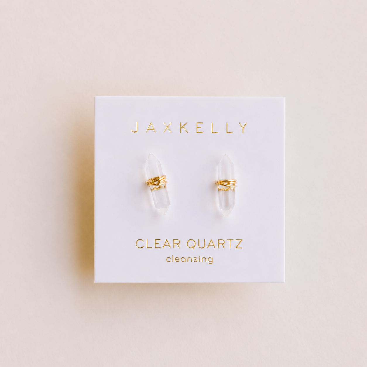These Clear Quartz Mineral Point earrings by JaxKelly are displayed on a white card labeled "Cleansing"—a beautiful, tarnish-free jewelry choice for those seeking both style and positive energy.