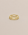 The JaxKelly Chain Link Gold Ring features an open oval link design, ideal for stacking, and is shown on a plain light beige background.