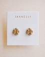 A pair of Rose Gold Druzy Prong stud earrings by JaxKelly featuring a sparkling textured surface and 18k gold plating.
