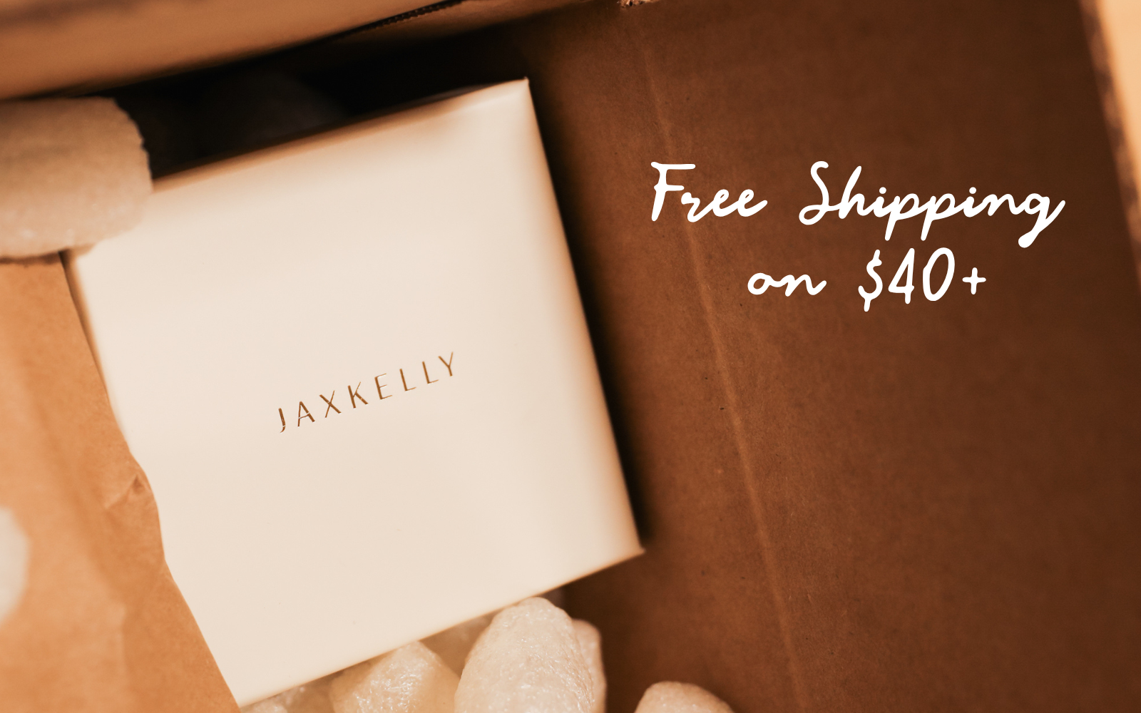 JaxKelly jewelry box in packaging with free shipping message