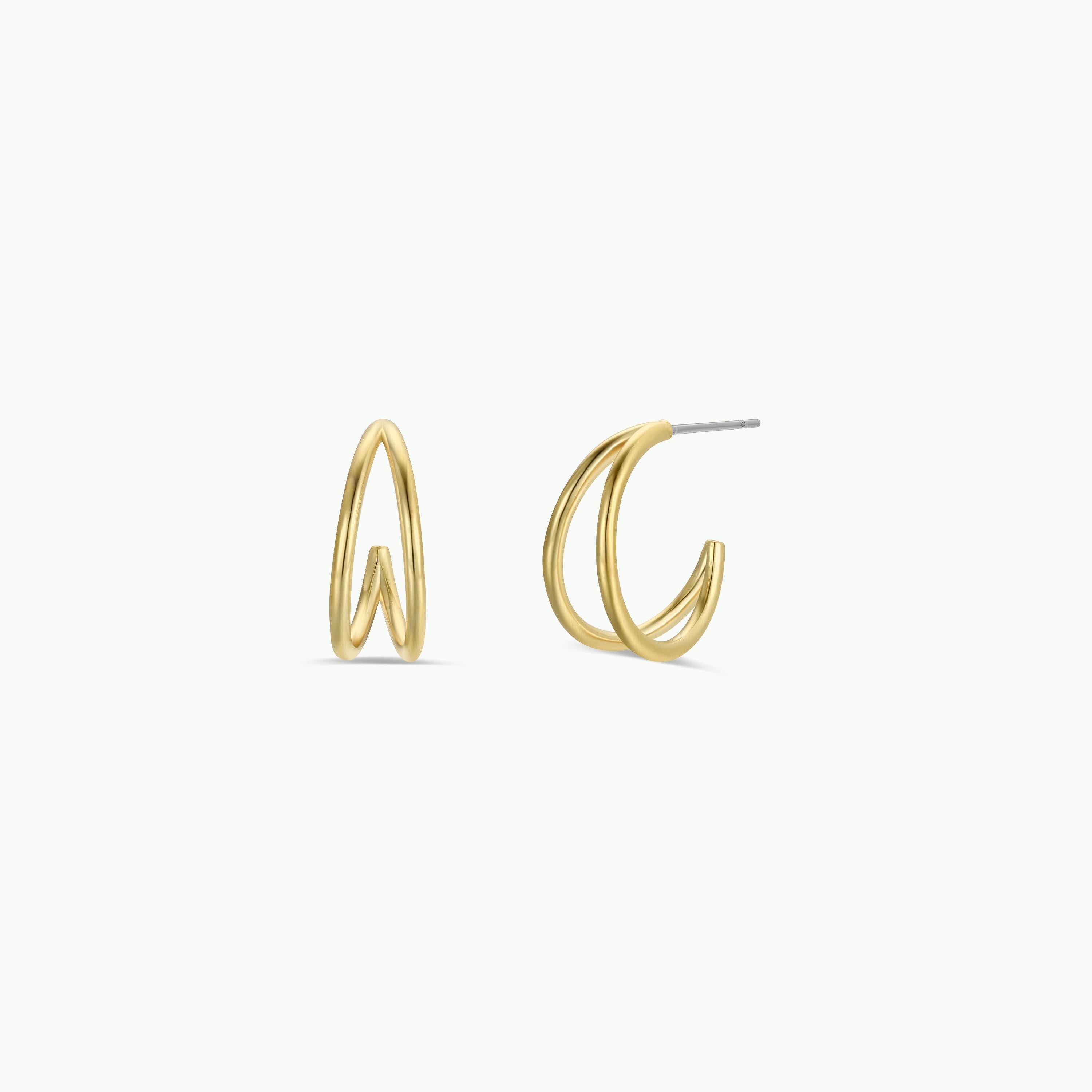 The Illusion Double Hoop - Gold Earrings showcase two intertwined, curved loops in a modern geometric design, expertly crafted from surgical-grade stainless steel and set against a plain white background.