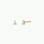 The Teardrop Stud - Clear CZ features small gold-plated stud earrings with clear, teardrop-shaped cubic zirconia set in three prongs and sterling silver posts, displayed on a plain white background.
