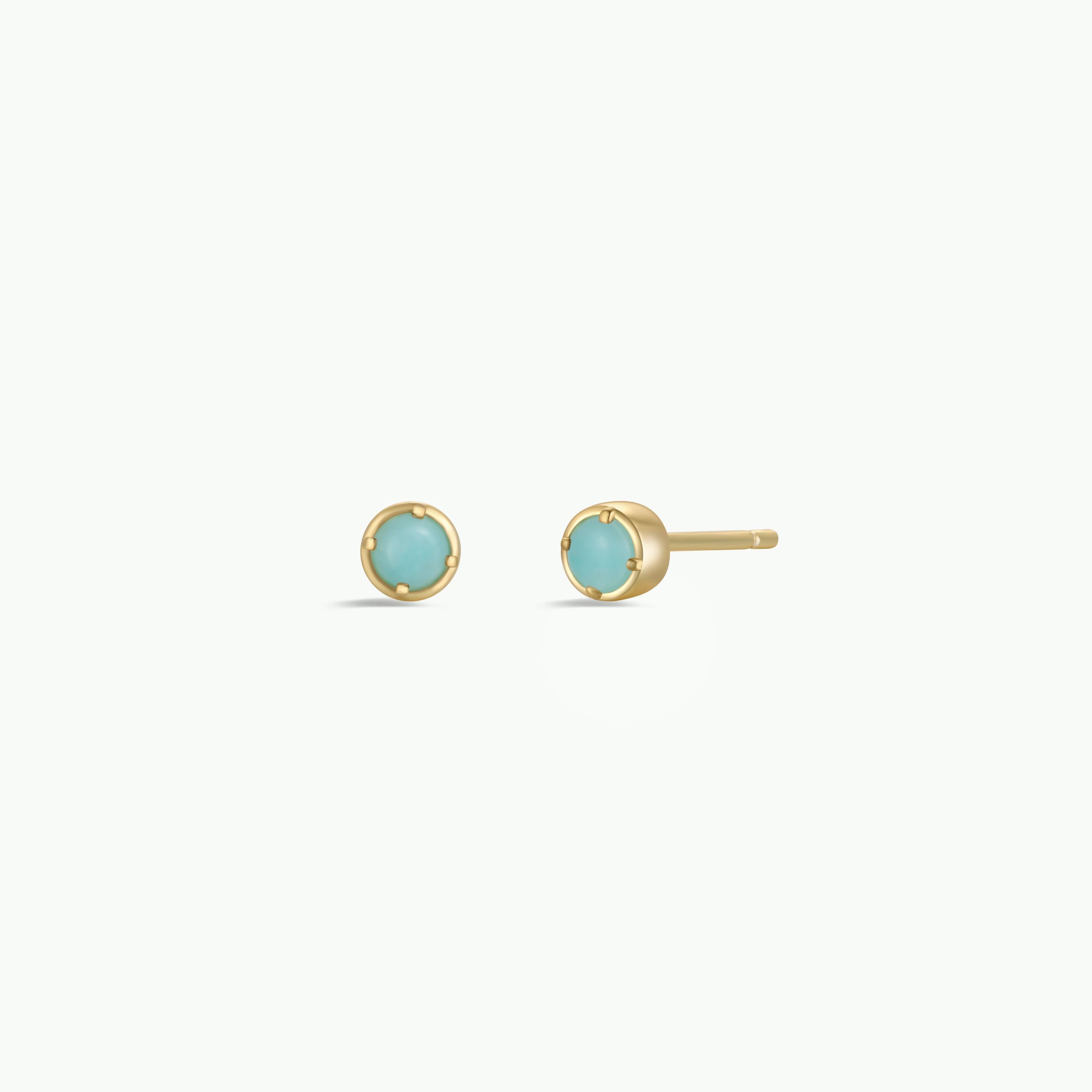 The Simple Stud Earring - Amazonite Gemstone features small, round light blue amazonite stones in gold-plated prong settings, with sterling silver posts, shown against a plain white background.