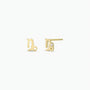 A pair of Zodiac Earrings - Capricorn, shaped like the lowercase letter d and crafted in 18k Gold Plating, shown from the front and side on a white background—ideal as unique stud earrings for ear piercings.