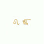 Zodiac Earrings - Leo: A pair of 18k gold plated stud earrings shaped like the Leo zodiac sign, with one earring featuring a small gemstone. Shown on a plain, light-colored background.