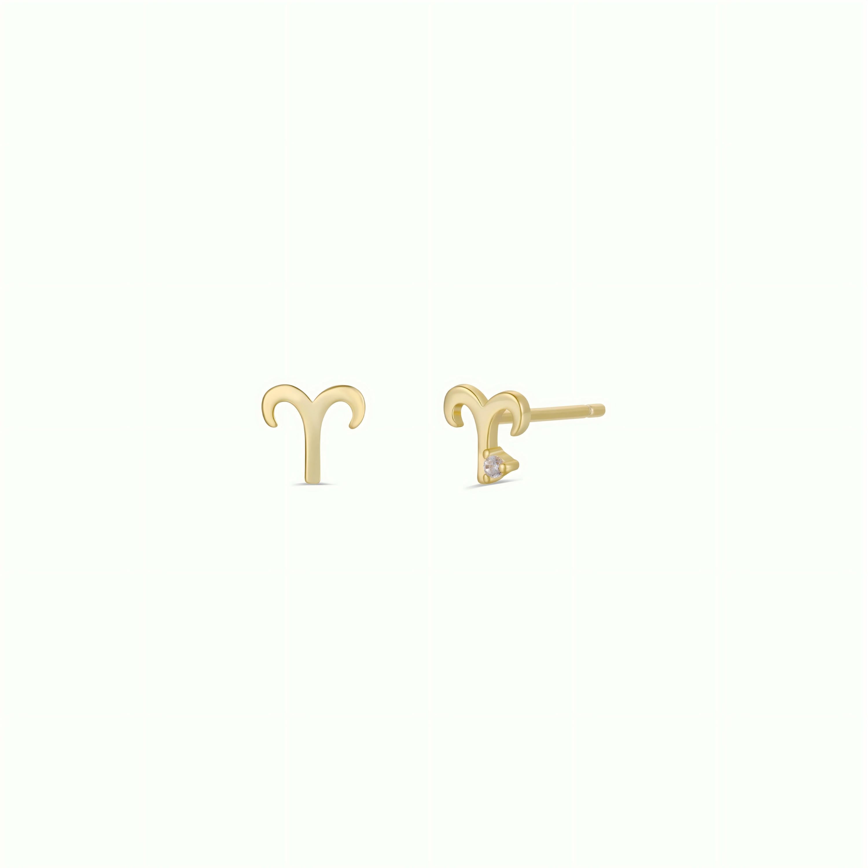 The Zodiac Earrings - Aries feature small gold-plated charm studs with sterling silver posts, shown on a light background—one earring displayed from the front, the other from the side.