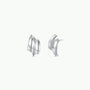 The JaxKelly Silver Bold Wave earrings are modern statement studs with a sleek wave design and sterling silver posts, shown from front and side views on a plain white background.