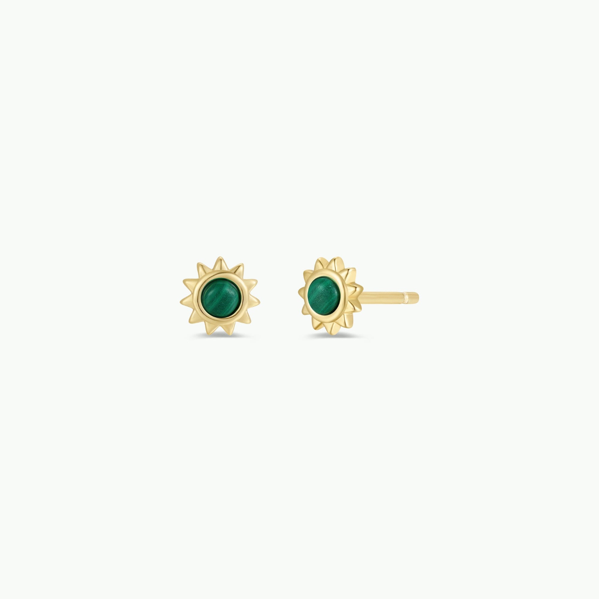 The Malachite Sun Stud features green malachite stone centers and 18k gold plating, shown on a plain light background.