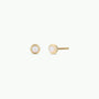 The Simple Stud - White Opal earrings are 18k gold plated with round lab-grown white opals in smooth bezels, displayed against a plain white background.
