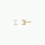 The White Opal Baguette features rectangular lab-grown white opal baguette stud earrings with 18k gold plating, displayed from the front and side on a plain white background.
