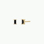 The Black Baguette features a pair of baguette stud earrings with small rectangular black stones set in four prongs, finished with 18k gold plating and sterling silver posts, displayed from the front and side on a white background.