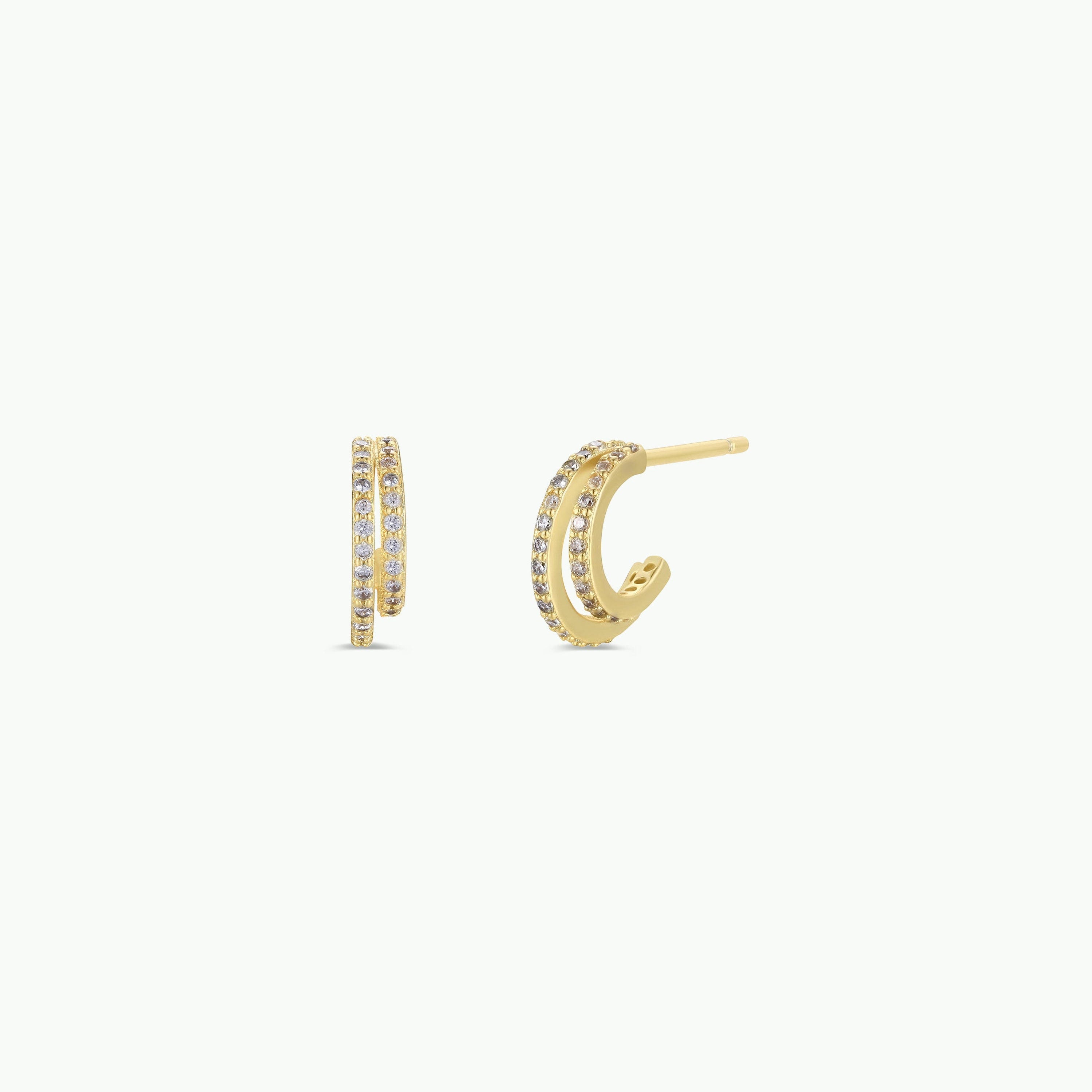 Double Champagne Hoop - Earrings: Small double offset hoops with 18K gold plating and two parallel rows of sparkling pave stones, shown on a plain white background.